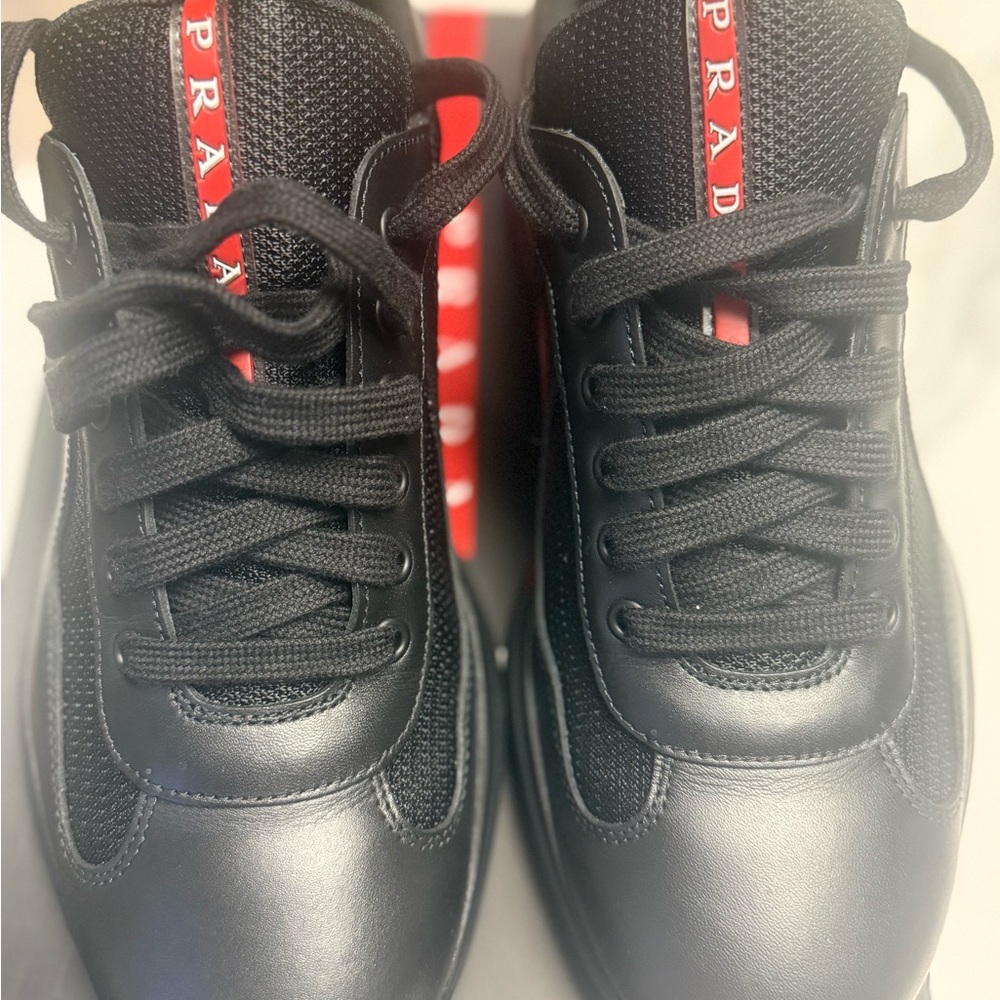 Prada Nero Sneakers with Red Stripe